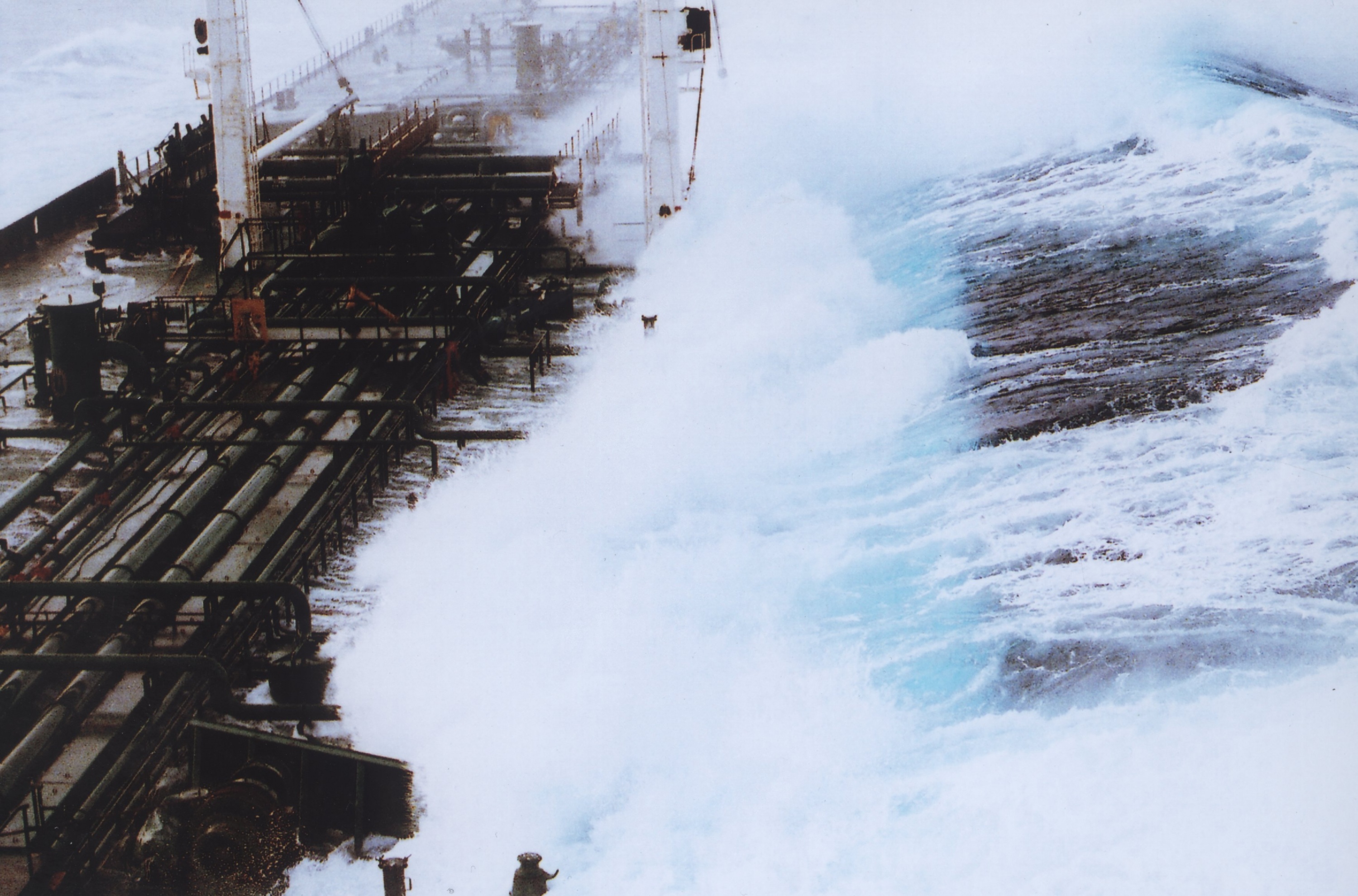A 60-foot rogue wave hits the OVERSEAS CHICAGO tanker as it was headed south from Valdez, Alaska in 1993. The ship was running in 25-foot seas when the monster wave hit it on the starboard side. (Credit: Captain Roger Wilson courtesy of NOAA)
