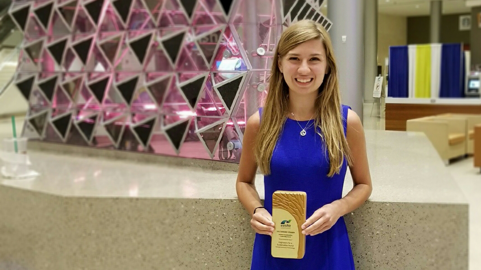Grace Brosofsky, BSEnvE 2017, stands with her Student Sustainability Leadership award from the Association for the Advancement of Sustainability in Higher Education. She won the award for a project she created with Engineers for a Sustainable World at Georgia Tech researching natural weed-control options. (Photo Courtesy: Grace Brosofsky)