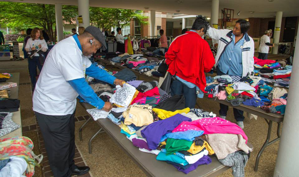 Attendees browse the clothing swap at Earth Day 2015