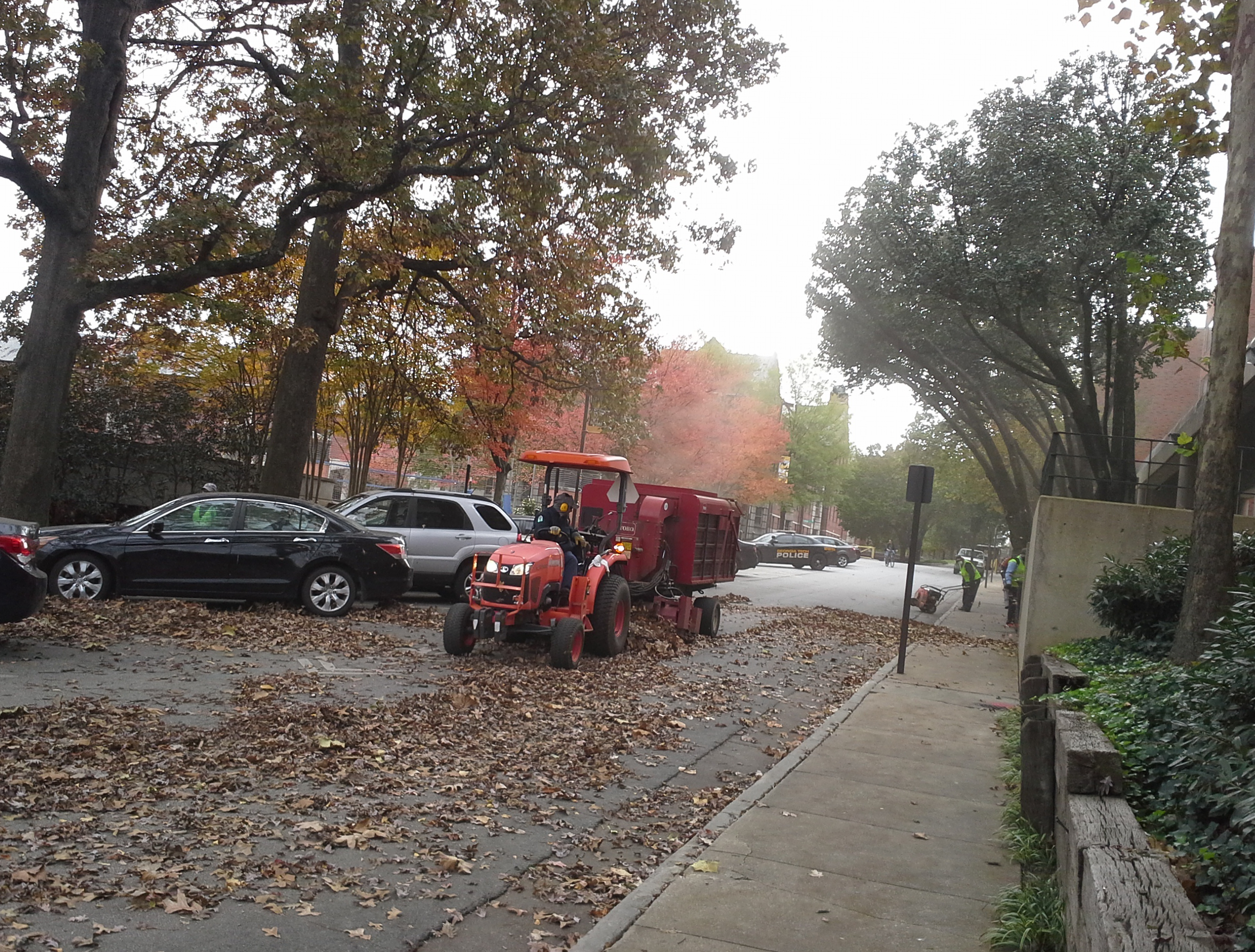 Landscape workers using Leaf-Vac to collect fall leaves that will be composted into mulch. Landscape workers using Leaf-Vac to collect fall leaves that will be composted into mulch.