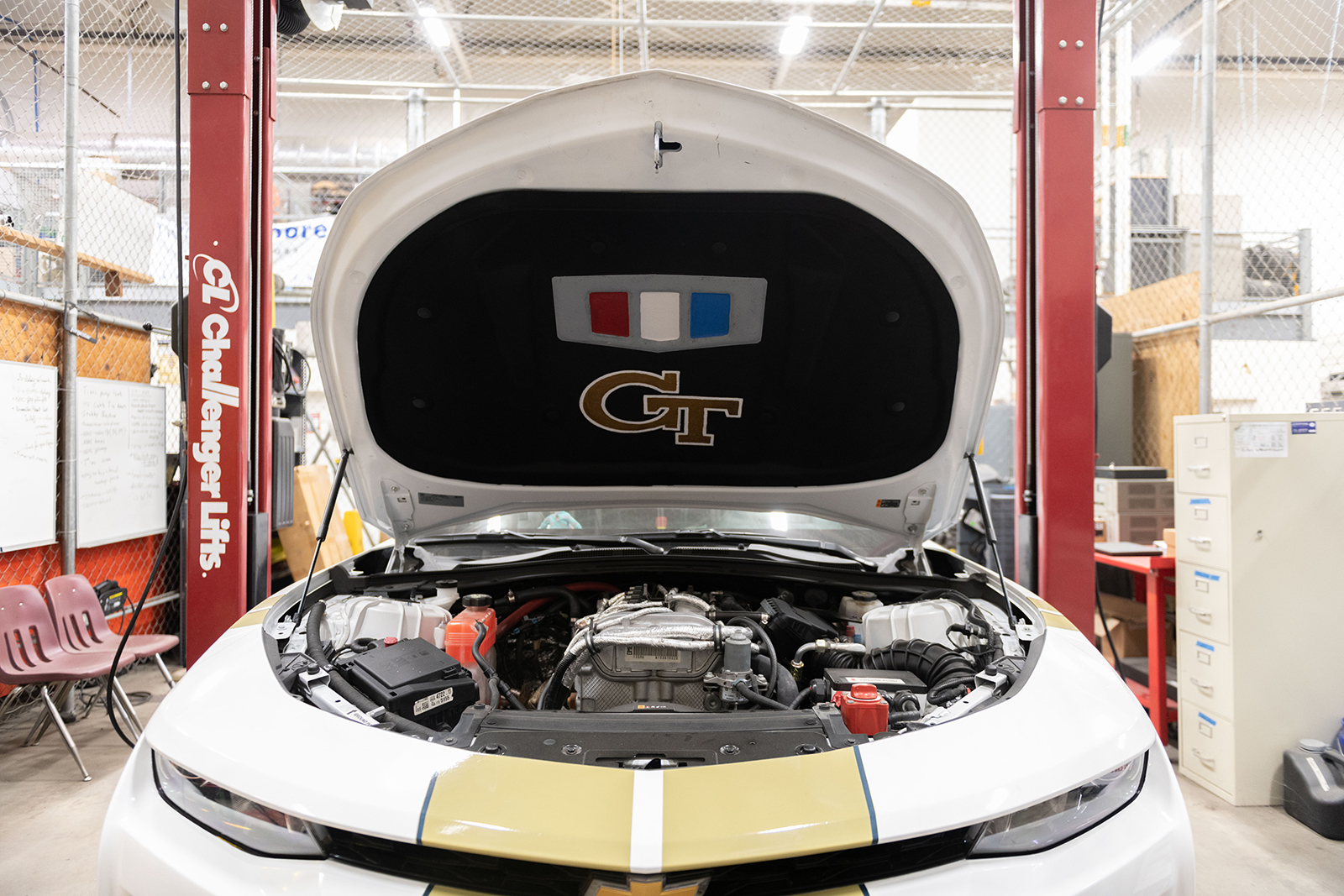 a car being worked on by students at the Student Competition Center