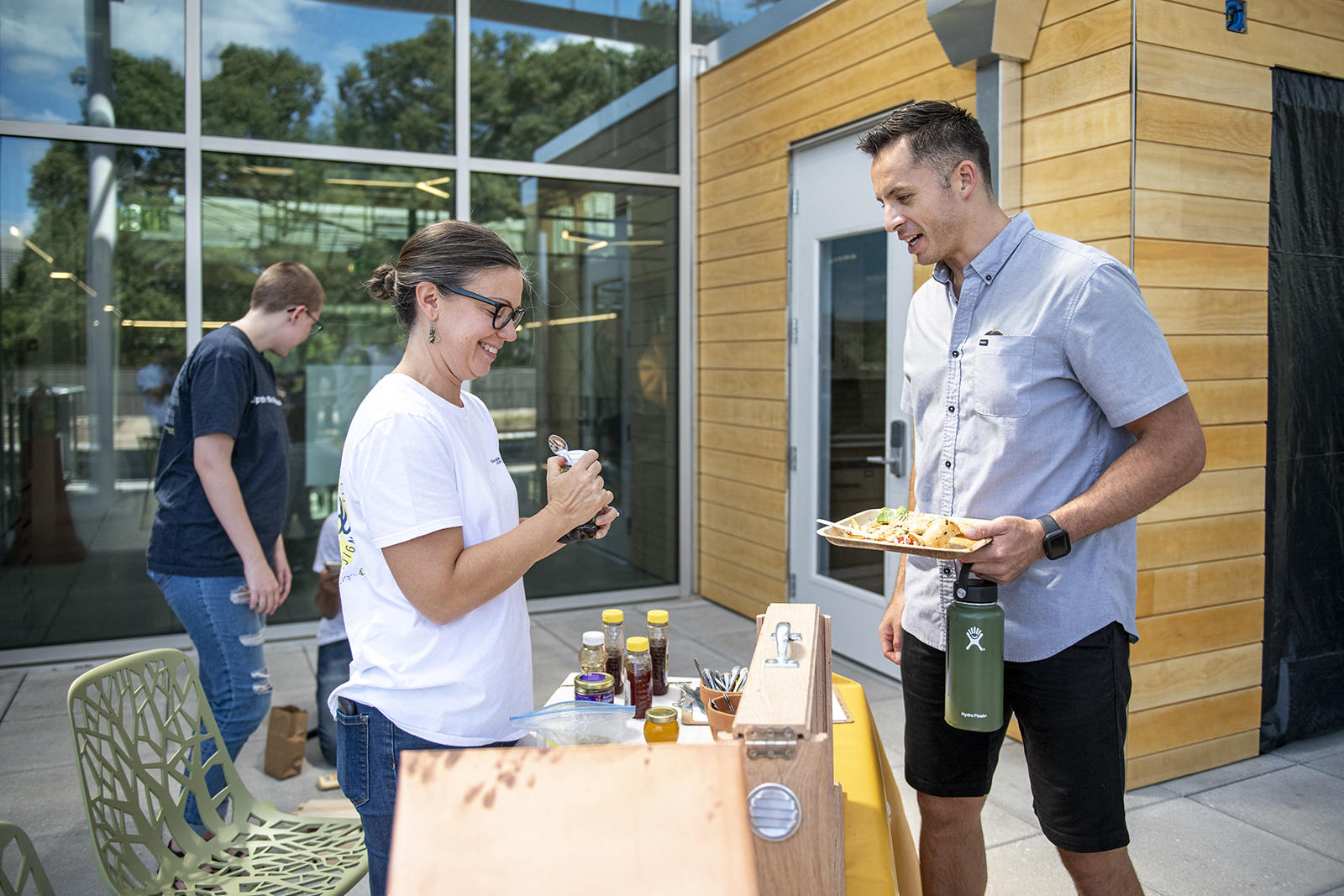 the Urban Honeybee Project gives out samples at the Kendeda Building opening in 2019