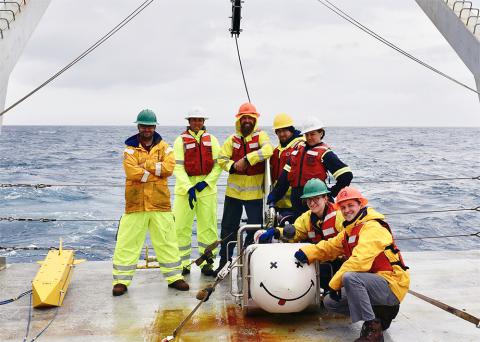 Samer Naif, left, with fellow researchers in the field (offshore New Zealand, for a separate research study). 